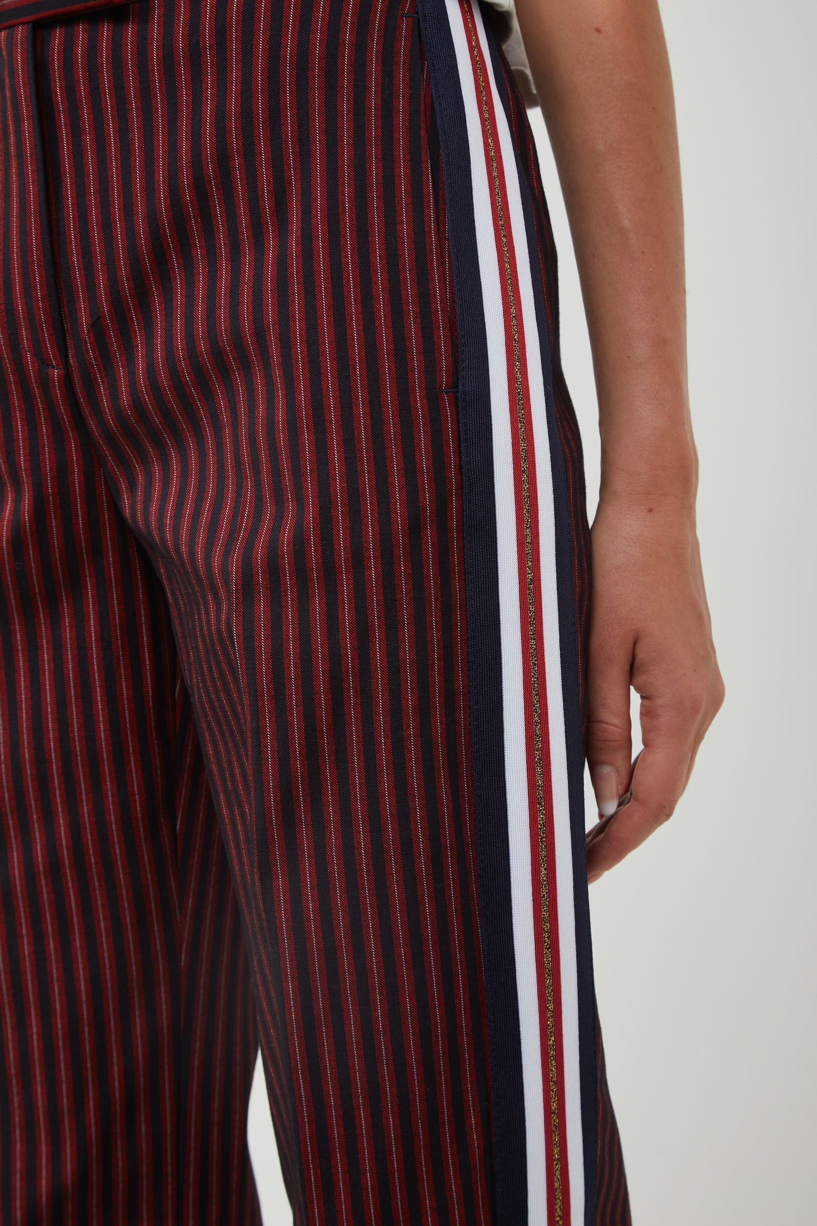 Pinstripe trousers with red stripe