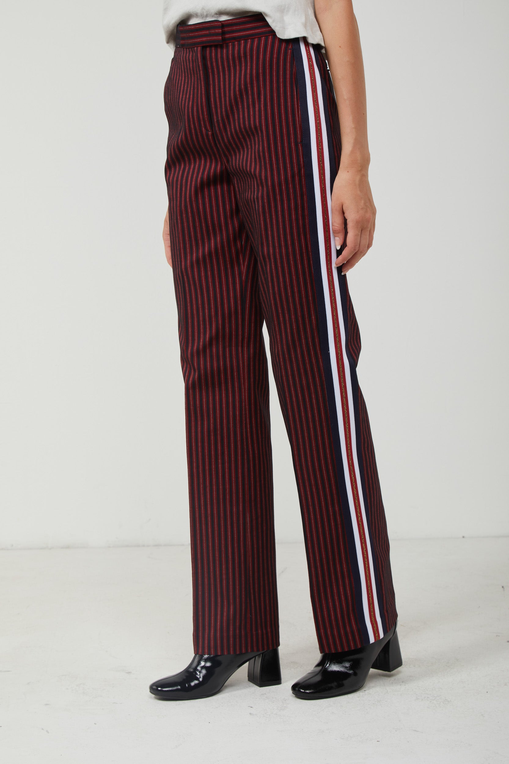 Pinstripe trousers with red stripe