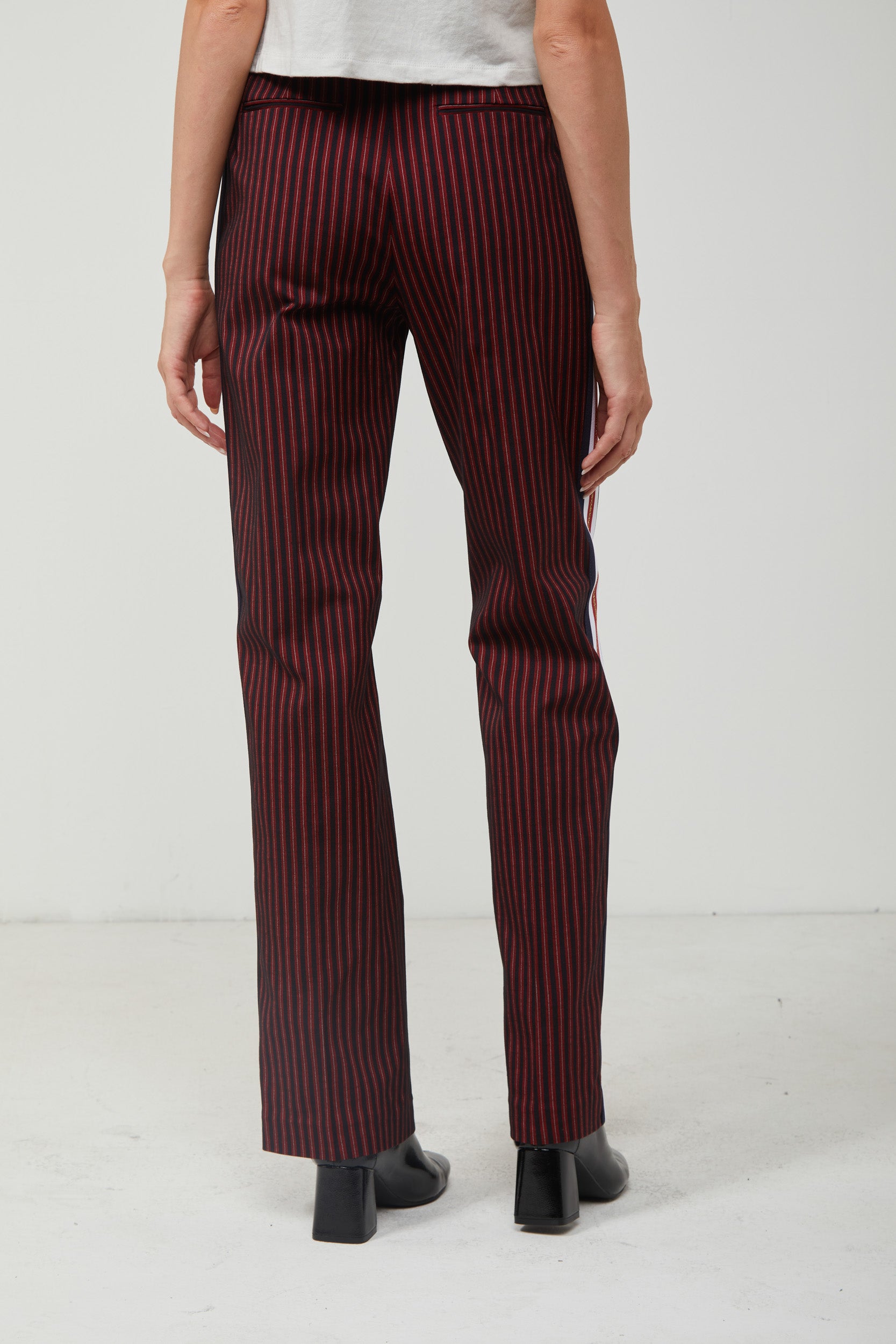 Pinstripe trousers with red stripe